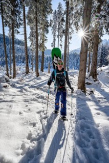Snowshoe hiker in snowy winter forest, Sonnenstern, Ascent to Teufelstättkopf, Snowy mountain