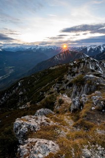 Mountain panorama, mountain landscape with sun star at sunset, at the summit of the Kramerspitz, in