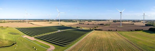 Wind farm and solar cells renewable energy wind power wind energy on the Baltic Sea aerial view