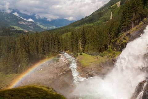 Krimml Waterfalls with rainbow. They have a total height of 380 metres (1, 247 feet) and are the