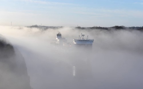 Container ship CMA CGM TIVOLI sailing in fog in the Kiel Canal, NOK, Kielkanal, Kiel Canal,