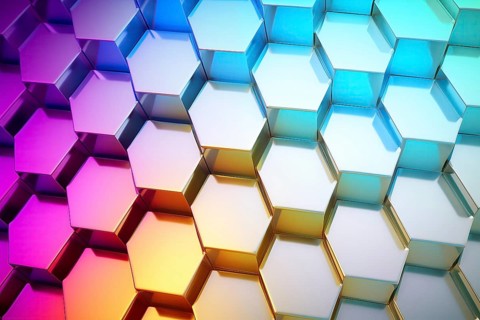 Gradient honeycomb pattern illuminated with vibrant colors. Ideal for backgrounds, wallpapers, and