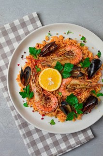 Seafood paella, shrimp and mussels risotto, rice, homemade, top view, no people