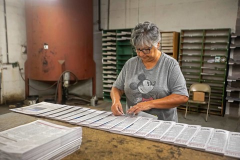 Liberal, Kansas, Lisa Diaz puts mailing labels on copies of the Kiowa County (Colorado) Independent