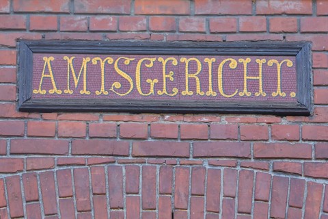 Local court in the historic town hall, red brick building, yellow inscription, detail, red, yellow,