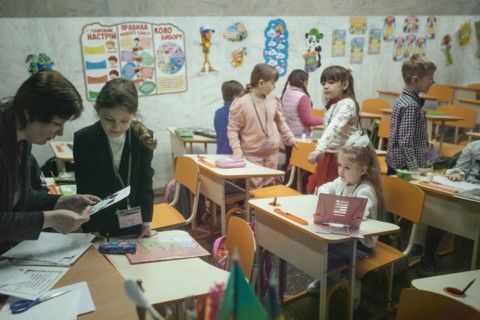 Pupils in a classroom in one of the metro schools in Kharkiv. Classrooms were set up in various