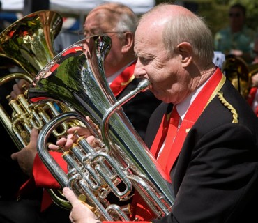 Musicians in a brass band perform during a country fair at Helmingham Hall, Suffolk, England,