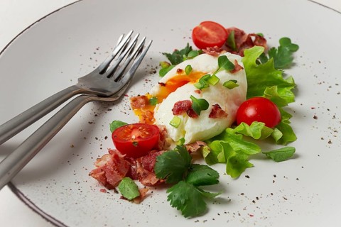 Poached egg, with bacon and vegetables, breakfast, homemade