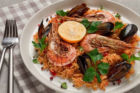 Seafood paella, shrimp and mussels risotto, rice, homemade, top view, no people