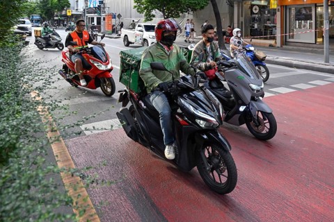 Grab scooter rider