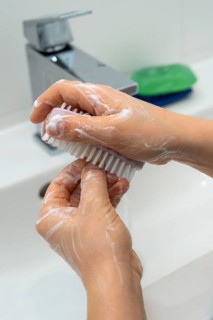 Domestic hygiene, washing hands, with a bar of soap, boy 9 years old