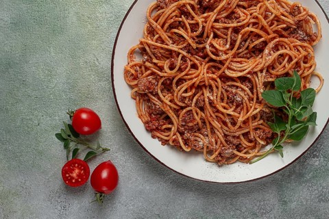 Spaghetti bolognese, in a frying pan, top view, homemade, no people