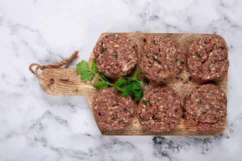 Raw cutlets, minced meat, on a chopping board, homemade, top view, no people