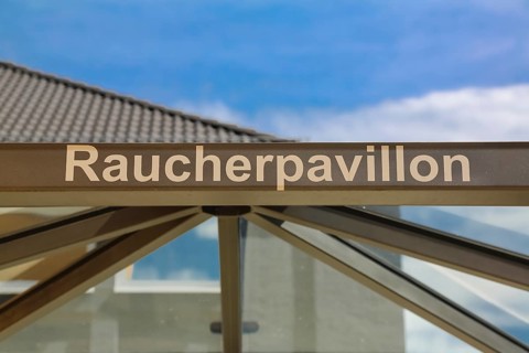 Smoking pavilion, glass shelter, smoking cabin, lettering, letters, Reutlingen, Baden-Württemberg,