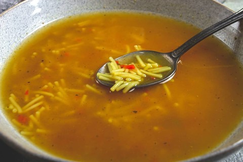 Chicken soup with noodles, homemade, no people, close-up