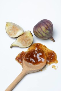 Fig jam in cooking spoon and fresh figs, Ficus carica