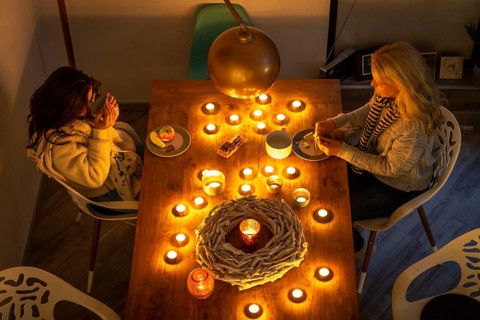Symbolic image energy saving, cold winter, energy crisis, cold flat, mother and daughter dressed