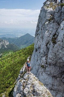 Climber with climbing rope on a climbing tour, climber on a mountain ridge, alpine climbing,