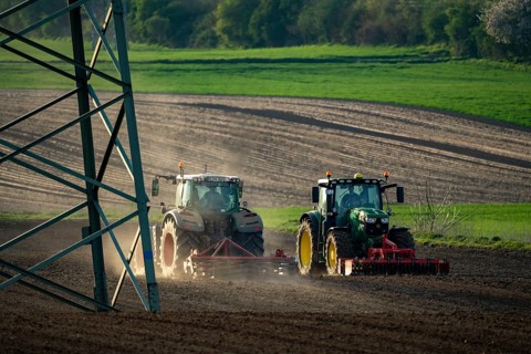 Tractor working a field near Grevenbroich, in spring, Germany, Europe