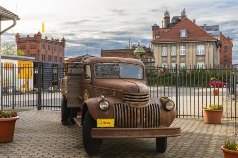 Historic car in front of the Weyermann malthouse, Bamberg, Lower Franconia, Bavaria, Germany,