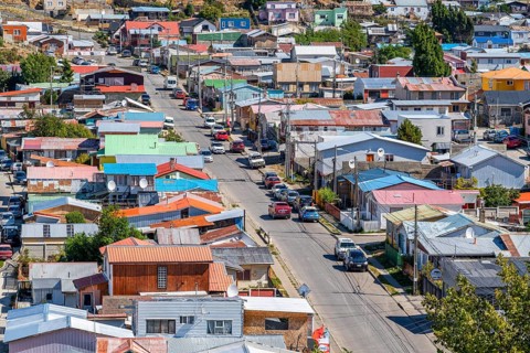 View over a street and colourful houses made of wood and corrugated iron, city of Punta Arenas,