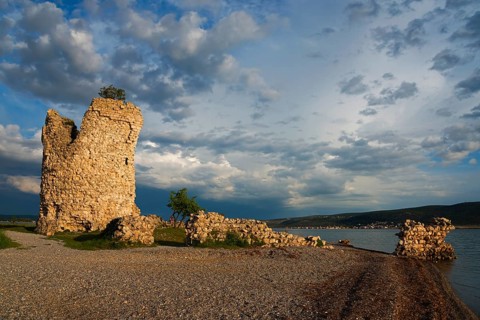 Old ruin by the sea at sunset under a cloudy blue sky, Vecka kula, Vecka Kula, Starigrad,