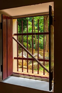 Open window of old colonial house with patio and garden in the historic city of Olinda, Olinda,
