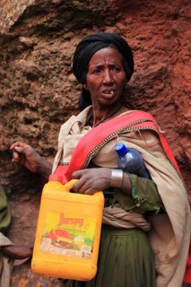 Pilgrim at the rock-hewn churches in Lalibela, container for holy water, Ethiopia, Africa