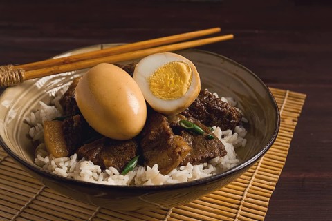 Stewed eggs, with pork belly, and rice, chinese food, homemade, selective focus, rustic, no people