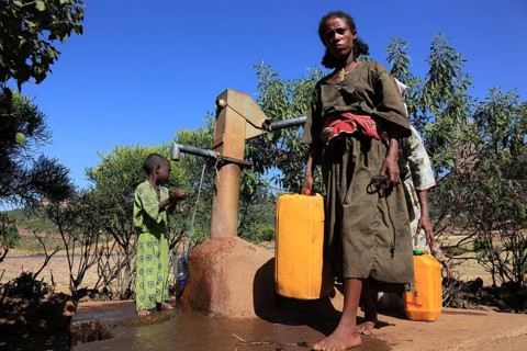 Amhara region, locals fetching water from a well, Ethiopia, Africa