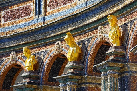 Gilded bust, facade, exterior walls, decorated, colourful, coloured stones, crystals and glass