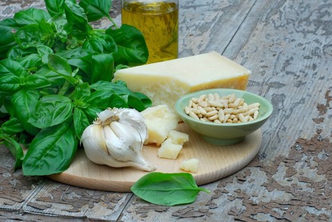 Ingredients for basil pesto, basil, parmesan, olive oil, pine nuts, garlic, parmesan cheese, basil