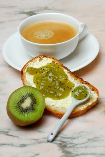 Kiwi, slice of bread with kiwi jam, cup of coffee (Actinidia chinensis, Actinidia (Actinidia
