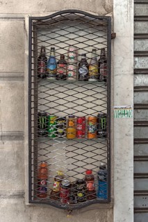 Barred drinks bar on a house wall in the historic city centre, Genoa, Italy, Europe