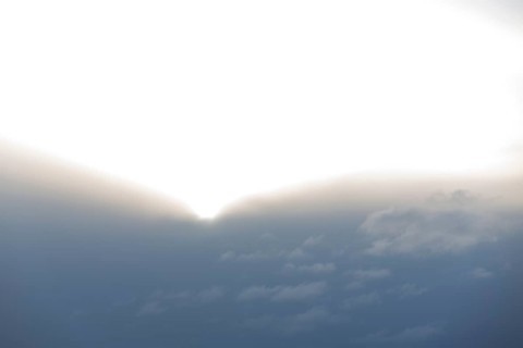 Sun comes out of thick cloud wall, Germany, Europe