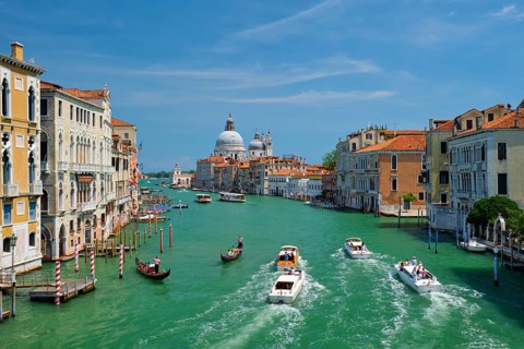 VENICE, ITALY, JULY 19, 2019: View of Venice Grand Canal with boats and Santa Maria della Salute
