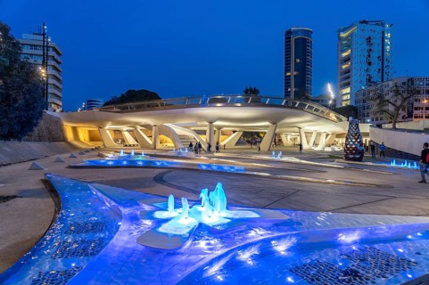 Modern architecture and colourfully lit fountains of Eleftheria Square at dusk, Nicosia, Cyprus,