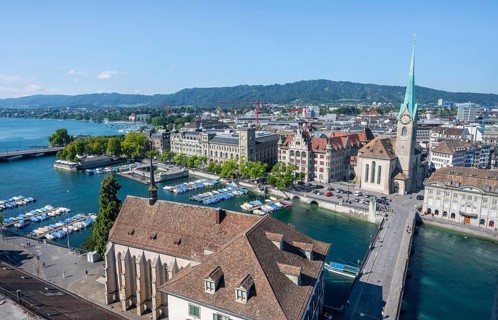View over the old town of Zurich with river Limmat, church Fraumünster and Münsterbrücke, from the