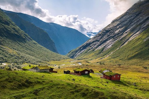 Traditional cabins with grass roofs in the mountain valley, Skjerdingsdalssætra, Stryn, Norway,