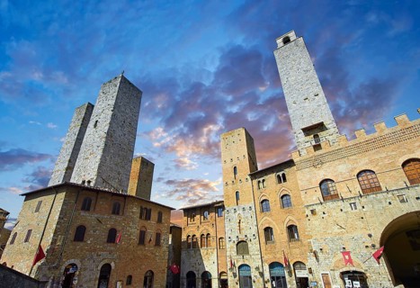 The Piazza Duomo (Cathedral Square) of San Gimignano with its medieval towers built as defensive