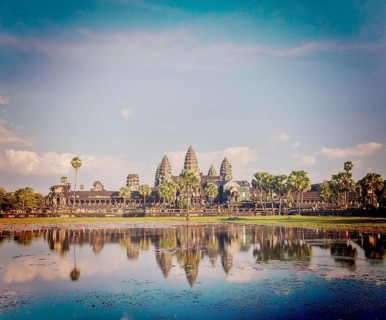 Vintage retro effect filtered hipster style image of Cambodia landmark Angkor Wat with reflection