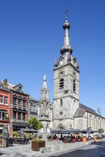 Saint Peter and St Paul Collegiate Church and Princes' fountain at Grand Place in the city Chimay,