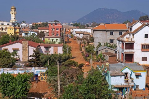 View over the city Antsirabe showing houses, unpaved road and Muslim mosque, Vakinankaratra Region,