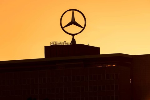 Mercedes star on Mercedes Benz branch in Stuttgart, after sunset, Baden-Württemberg, Germany,