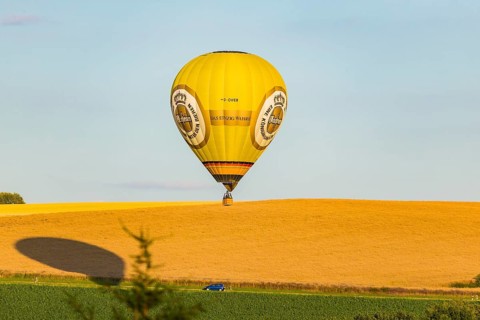 Summer balloon flight over the foothills of the Osterzgebirge mountains