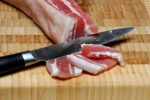 Salted bacon, pork bacon, cured bacon, knife
