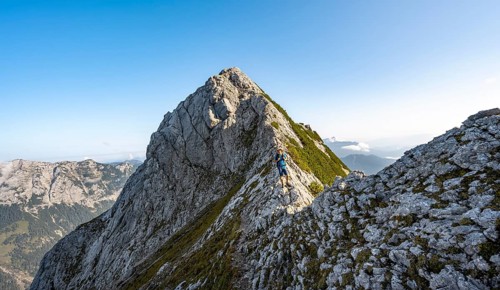 Mountaineer on a narrow ridge, mountain tour to the summit of the Hochkalter, Hochkalter crossing,