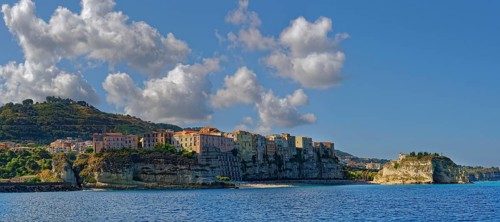 Morning city view of the medieval old town of Tropea with the church Santuario di Santa Maria,