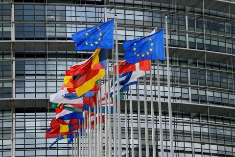 European flags in the wind in front of the European Parliament, Louise Weiss Building, Strasbourg,