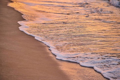 Sunrise with morning colors on a sandy beach near Tarragona, Catalonia, Spain, Europe